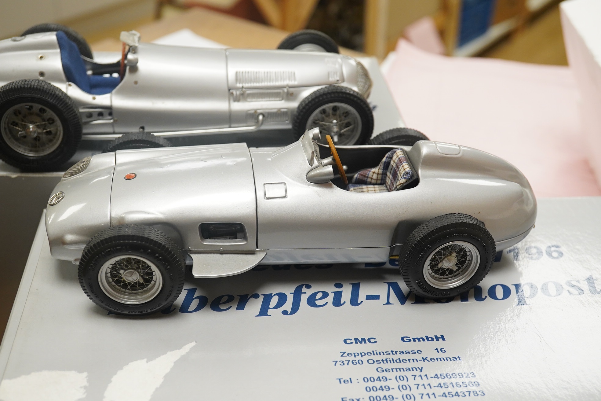 Two boxed CMC 1:18 scale diecast model cars; a Mercedes-Benz W196, together with a Mercedes-Benz W154 1938. Condition - fair to good, and slight metal fatiguing to the bonnet on the W196 as occasionally found with early